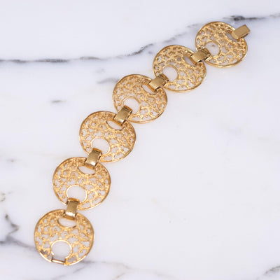 Vintage Trifari Wide Gold Cut Out Link Bracelet by Crown Trifari - Vintage Meet Modern Vintage Jewelry - Chicago, Illinois - #oldhollywoodglamour #vintagemeetmodern #designervintage #jewelrybox #antiquejewelry #vintagejewelry