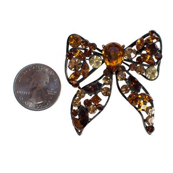 Vintage Rhinestone Bow Brooch Amber, Citrine, Golden Yellow Rhinestones Black Japanned Metal Setting by 1960s - Vintage Meet Modern Vintage Jewelry - Chicago, Illinois - #oldhollywoodglamour #vintagemeetmodern #designervintage #jewelrybox #antiquejewelry #vintagejewelry