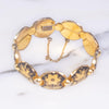 Vintage Damascene Gold and Black Round Panel Link Bracelet with Flowers and Birds by Made in Spain - Vintage Meet Modern Vintage Jewelry - Chicago, Illinois - #oldhollywoodglamour #vintagemeetmodern #designervintage #jewelrybox #antiquejewelry #vintagejewelry