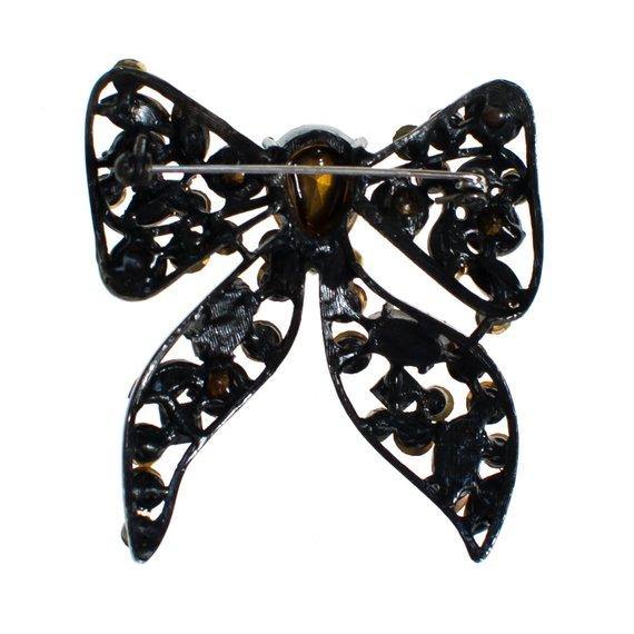 Vintage Rhinestone Bow Brooch Amber, Citrine, Golden Yellow Rhinestones Black Japanned Metal Setting by 1960s - Vintage Meet Modern Vintage Jewelry - Chicago, Illinois - #oldhollywoodglamour #vintagemeetmodern #designervintage #jewelrybox #antiquejewelry #vintagejewelry