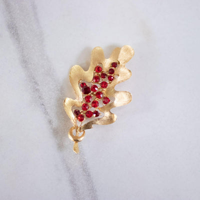 Vintage Gold Leaf and Red Rhinestone Brooch by JJ - Vintage Meet Modern Vintage Jewelry - Chicago, Illinois - #oldhollywoodglamour #vintagemeetmodern #designervintage #jewelrybox #antiquejewelry #vintagejewelry