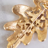 Vintage Gold Leaf and Red Rhinestone Brooch by JJ - Vintage Meet Modern Vintage Jewelry - Chicago, Illinois - #oldhollywoodglamour #vintagemeetmodern #designervintage #jewelrybox #antiquejewelry #vintagejewelry