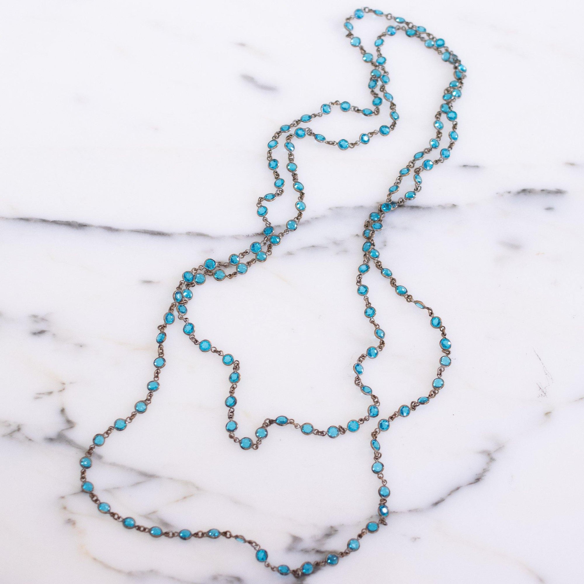 Art Deco Era Blue Petite Crystal Bezel Set Sautoir Necklace by Czech - Vintage Meet Modern Vintage Jewelry - Chicago, Illinois - #oldhollywoodglamour #vintagemeetmodern #designervintage #jewelrybox #antiquejewelry #vintagejewelry