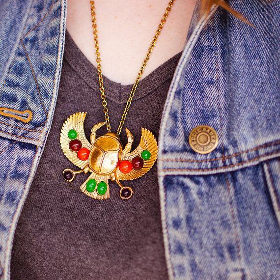 Gold tone Tutankhamun Winged Falcon Scarab Statement Necklace by Falcon Scarab - Vintage Meet Modern Vintage Jewelry - Chicago, Illinois - #oldhollywoodglamour #vintagemeetmodern #designervintage #jewelrybox #antiquejewelry #vintagejewelry