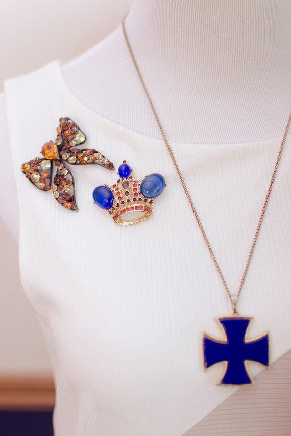 Vintage Royal Gold Crown Brooch with Sapphire Blue Cabochons and Red and Gray Enamel Accents by 1980s - Vintage Meet Modern Vintage Jewelry - Chicago, Illinois - #oldhollywoodglamour #vintagemeetmodern #designervintage #jewelrybox #antiquejewelry #vintagejewelry