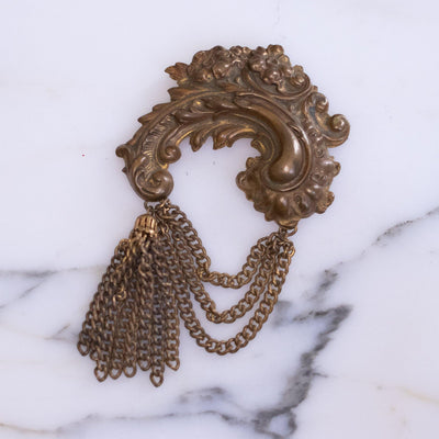 Art Nouveau Gilt Swag Brooch Embossed Design with Gold Tassel by Unsigned - Vintage Meet Modern Vintage Jewelry - Chicago, Illinois - #oldhollywoodglamour #vintagemeetmodern #designervintage #jewelrybox #antiquejewelry #vintagejewelry