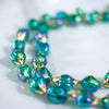 Vintage Iridescent Green Beaded Double Strand Necklace by Hong Kong - Vintage Meet Modern Vintage Jewelry - Chicago, Illinois - #oldhollywoodglamour #vintagemeetmodern #designervintage #jewelrybox #antiquejewelry #vintagejewelry