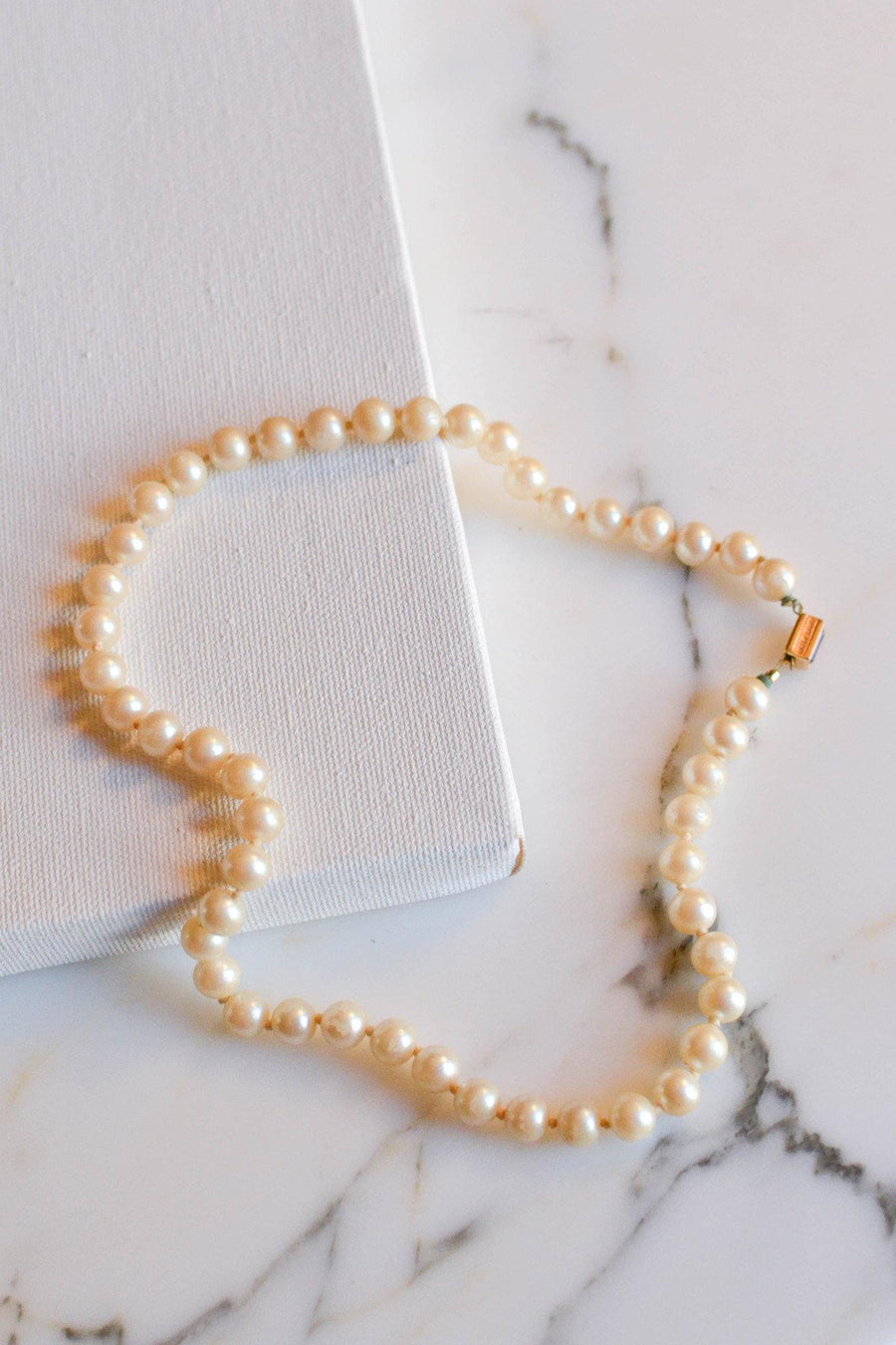 Strand of Pearls with Amethyst Crystal Clasp by Anne Klein by Anne Klein - Vintage Meet Modern Vintage Jewelry - Chicago, Illinois - #oldhollywoodglamour #vintagemeetmodern #designervintage #jewelrybox #antiquejewelry #vintagejewelry