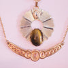 Tigers Eye Egyptian Revival Medallion Necklace by Vintage Meet Modern - Vintage Meet Modern Vintage Jewelry - Chicago, Illinois - #oldhollywoodglamour #vintagemeetmodern #designervintage #jewelrybox #antiquejewelry #vintagejewelry