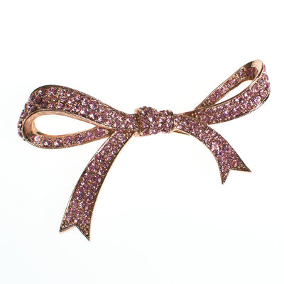 Vintage Pink Rhinestone Bow Brooch by Kenneth Jay Lane by Vintage Meet Modern  - Vintage Meet Modern Vintage Jewelry - Chicago, Illinois - #oldhollywoodglamour #vintagemeetmodern #designervintage #jewelrybox #antiquejewelry #vintagejewelry