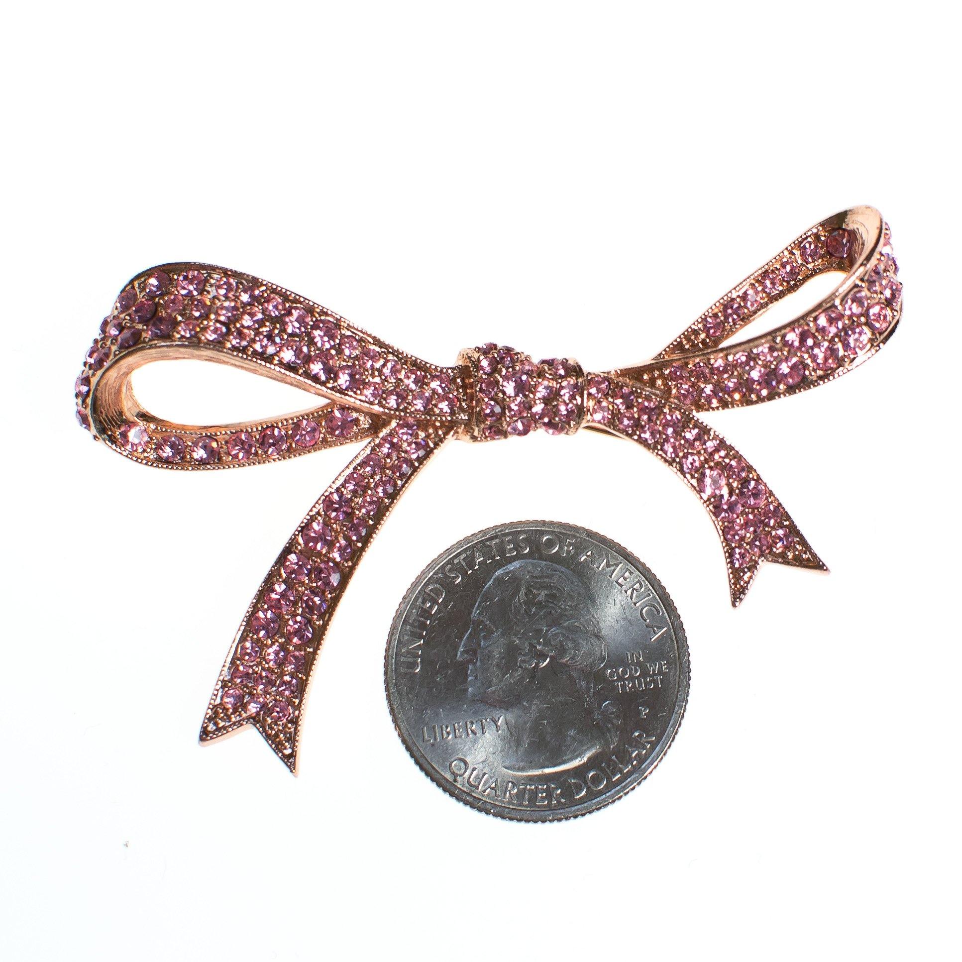 Vintage Pink Rhinestone Bow Brooch by Kenneth Jay Lane by Vintage Meet Modern - Vintage Meet Modern Vintage Jewelry - Chicago, Illinois - #oldhollywoodglamour #vintagemeetmodern #designervintage #jewelrybox #antiquejewelry #vintagejewelry