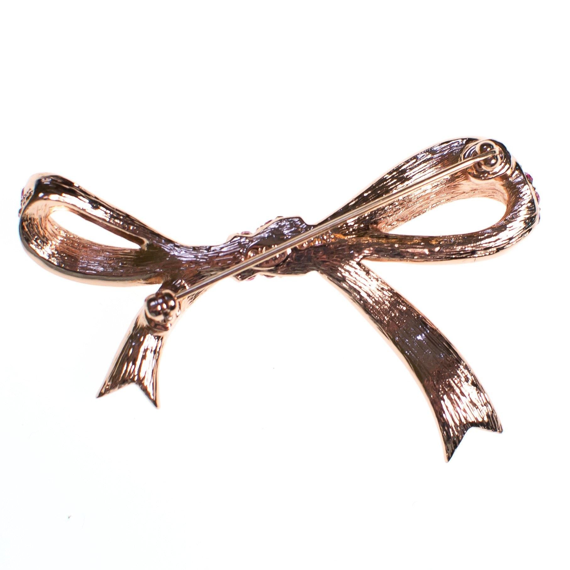 Vintage Pink Rhinestone Bow Brooch by Kenneth Jay Lane by Vintage Meet Modern - Vintage Meet Modern Vintage Jewelry - Chicago, Illinois - #oldhollywoodglamour #vintagemeetmodern #designervintage #jewelrybox #antiquejewelry #vintagejewelry