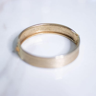 Vintage Gold Brushed Tone Hinged Bangle Bracelet by Unsigned Beauty - Vintage Meet Modern Vintage Jewelry - Chicago, Illinois - #oldhollywoodglamour #vintagemeetmodern #designervintage #jewelrybox #antiquejewelry #vintagejewelry