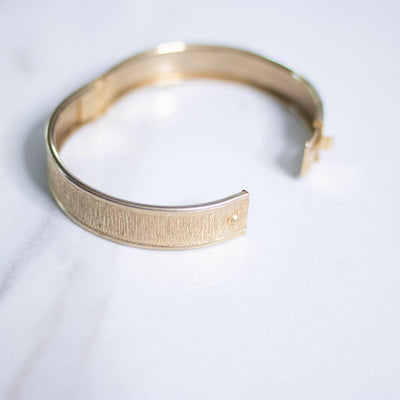 Vintage Gold Brushed Tone Hinged Bangle Bracelet by Unsigned Beauty - Vintage Meet Modern Vintage Jewelry - Chicago, Illinois - #oldhollywoodglamour #vintagemeetmodern #designervintage #jewelrybox #antiquejewelry #vintagejewelry