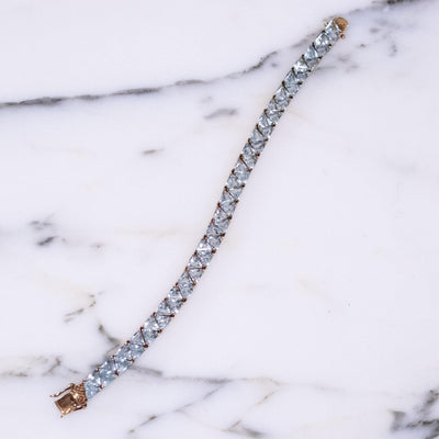 Vintage Suzanne Somers  Blue Topaz Trillion CZ Cut 18kt Gold Over Sterling Silver Tennis Bracelet by Suzanne Somers - Vintage Meet Modern Vintage Jewelry - Chicago, Illinois - #oldhollywoodglamour #vintagemeetmodern #designervintage #jewelrybox #antiquejewelry #vintagejewelry