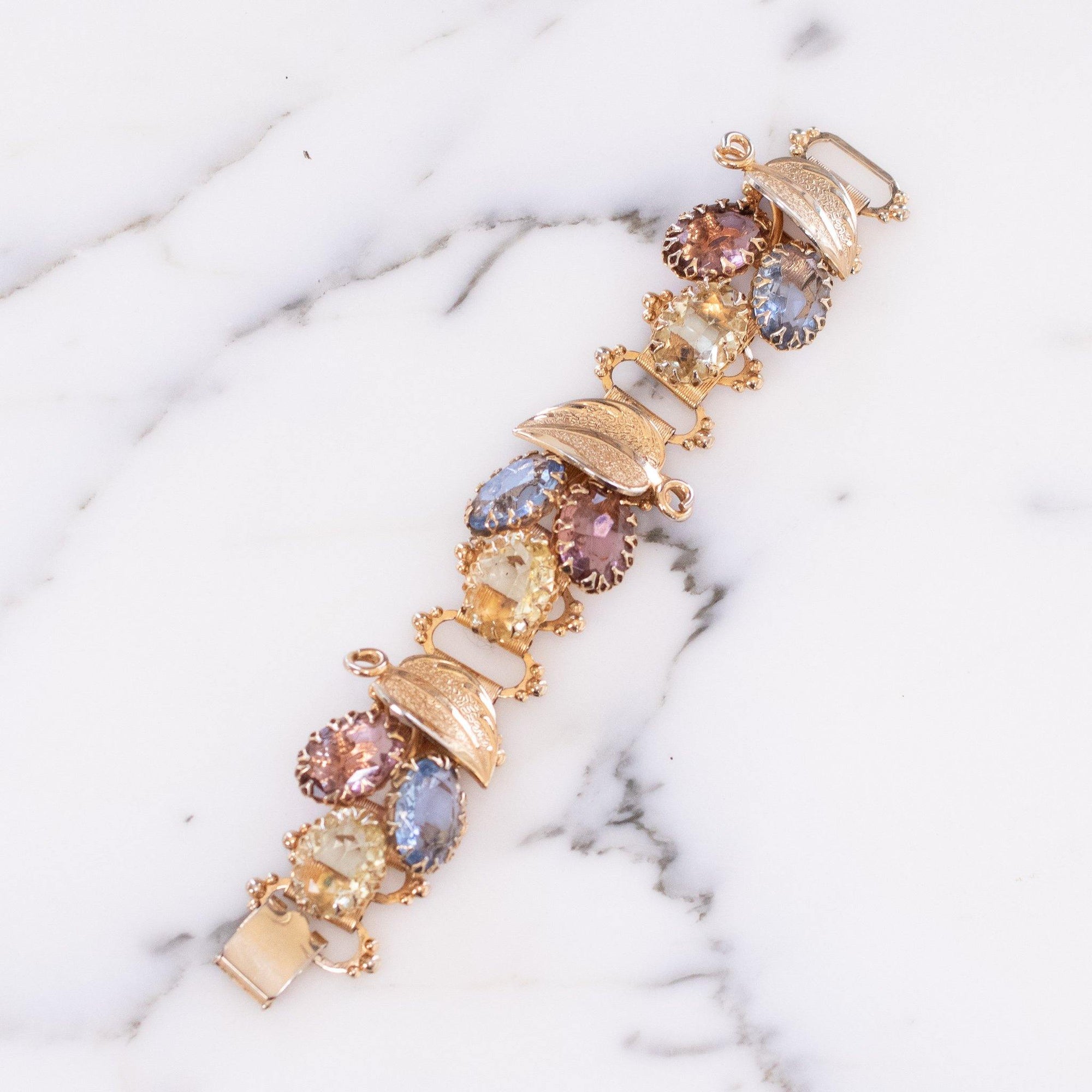 Vintage Blue, Rose, and Lemon Yellow Rhinestone Book Chain Bracelet with Leaf Details by Vintage Meet Modern - Vintage Meet Modern Vintage Jewelry - Chicago, Illinois - #oldhollywoodglamour #vintagemeetmodern #designervintage #jewelrybox #antiquejewelry #vintagejewelry