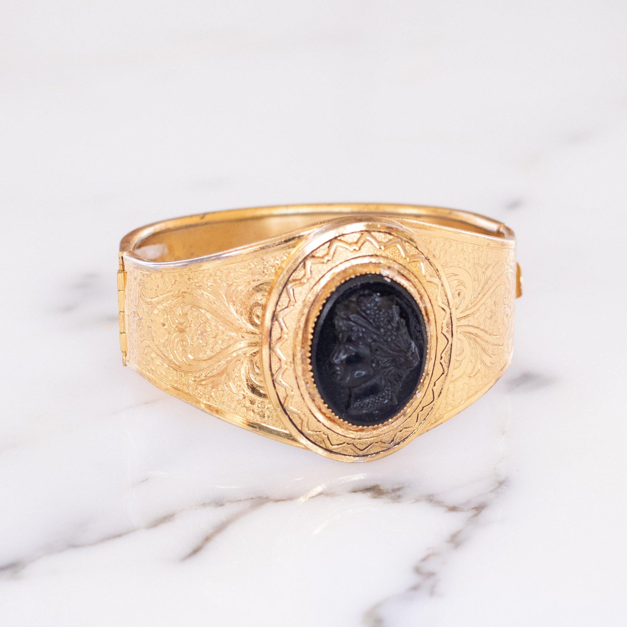Vintage Czech Gold Tone Embossed Cuff Bracelet with Black Lucite Cameo by Czech - Vintage Meet Modern Vintage Jewelry - Chicago, Illinois - #oldhollywoodglamour #vintagemeetmodern #designervintage #jewelrybox #antiquejewelry #vintagejewelry