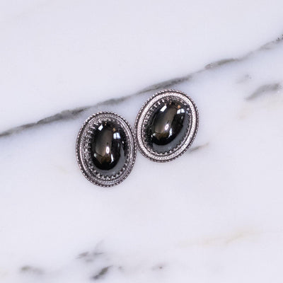 Vintage Whiting and Davis Victorian Revival Oval Hematite Glass Statement Earrings by Vintage Meet Modern - Vintage Meet Modern Vintage Jewelry - Chicago, Illinois - #oldhollywoodglamour #vintagemeetmodern #designervintage #jewelrybox #antiquejewelry #vintagejewelry