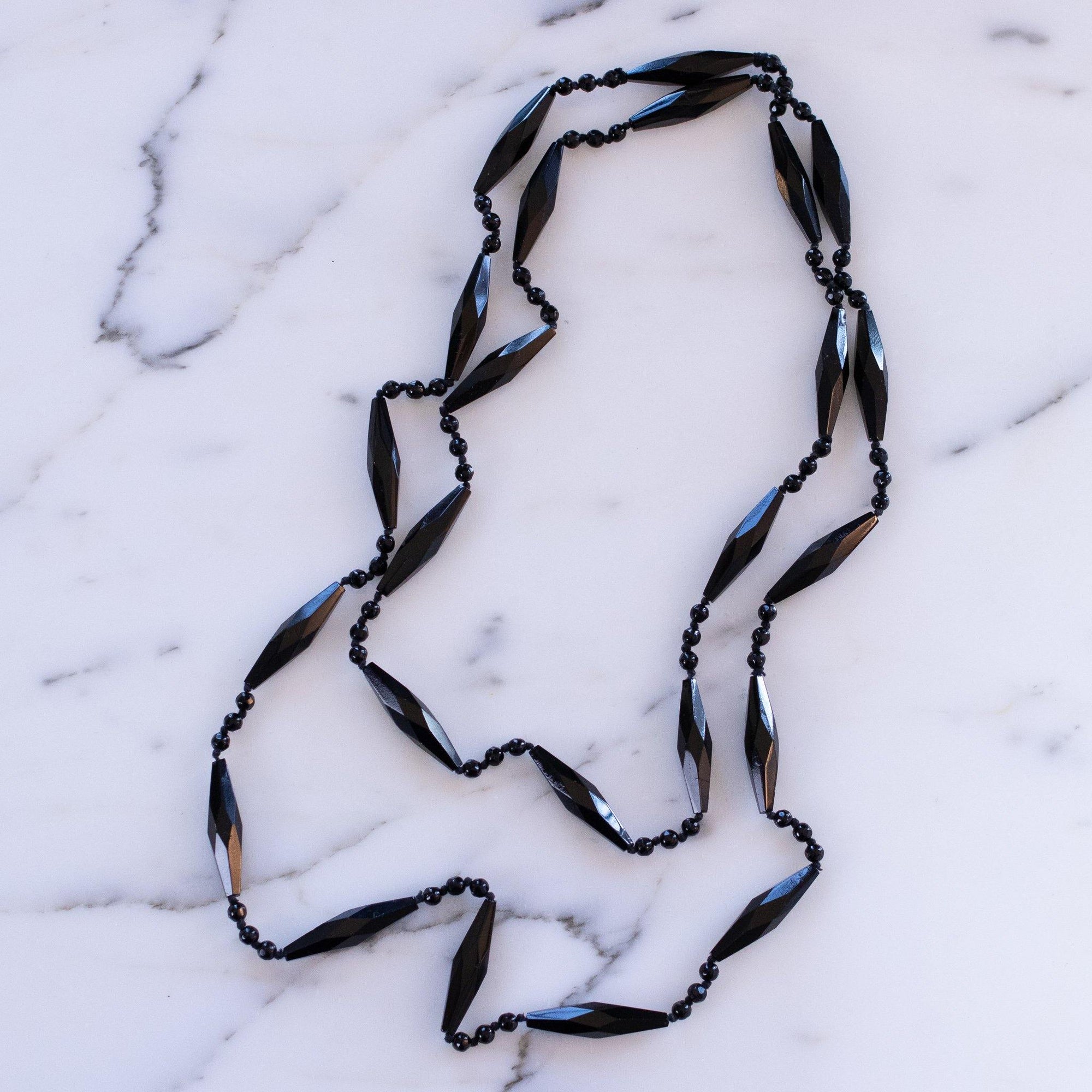 Vintage Art Deco Czech Faceted Jet Crystal Sautoir Necklace by Vintage Meet Modern - Vintage Meet Modern Vintage Jewelry - Chicago, Illinois - #oldhollywoodglamour #vintagemeetmodern #designervintage #jewelrybox #antiquejewelry #vintagejewelry