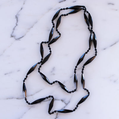Vintage Art Deco Czech Faceted Jet Crystal Sautoir Necklace by Vintage Meet Modern  - Vintage Meet Modern Vintage Jewelry - Chicago, Illinois - #oldhollywoodglamour #vintagemeetmodern #designervintage #jewelrybox #antiquejewelry #vintagejewelry