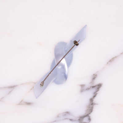 Vintage Knotted Early Plastic Lucite Silver Moonglow Brooch by Unsigned Beauty - Vintage Meet Modern Vintage Jewelry - Chicago, Illinois - #oldhollywoodglamour #vintagemeetmodern #designervintage #jewelrybox #antiquejewelry #vintagejewelry