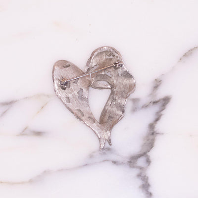 Vintage Heart Shaped Silver Ribbon Brooch by Vintage Meet Modern - Vintage Meet Modern Vintage Jewelry - Chicago, Illinois - #oldhollywoodglamour #vintagemeetmodern #designervintage #jewelrybox #antiquejewelry #vintagejewelry