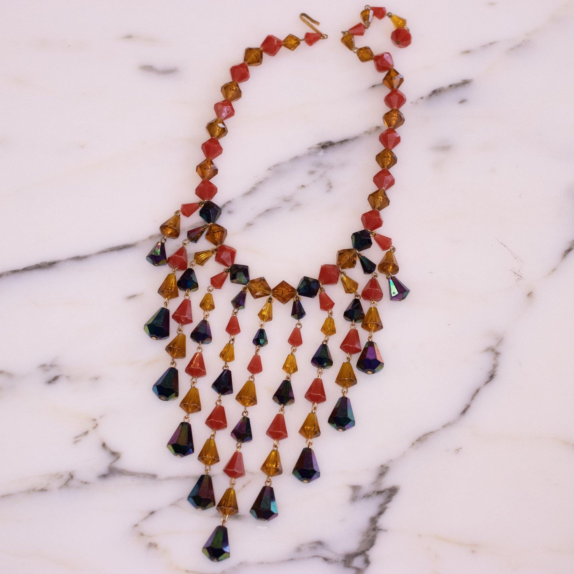 Vintage Black Aurora Borealis, Carnelian Lucite, and Citrine Lucite Bib Necklace by West Germany - Vintage Meet Modern Vintage Jewelry - Chicago, Illinois - #oldhollywoodglamour #vintagemeetmodern #designervintage #jewelrybox #antiquejewelry #vintagejewelry