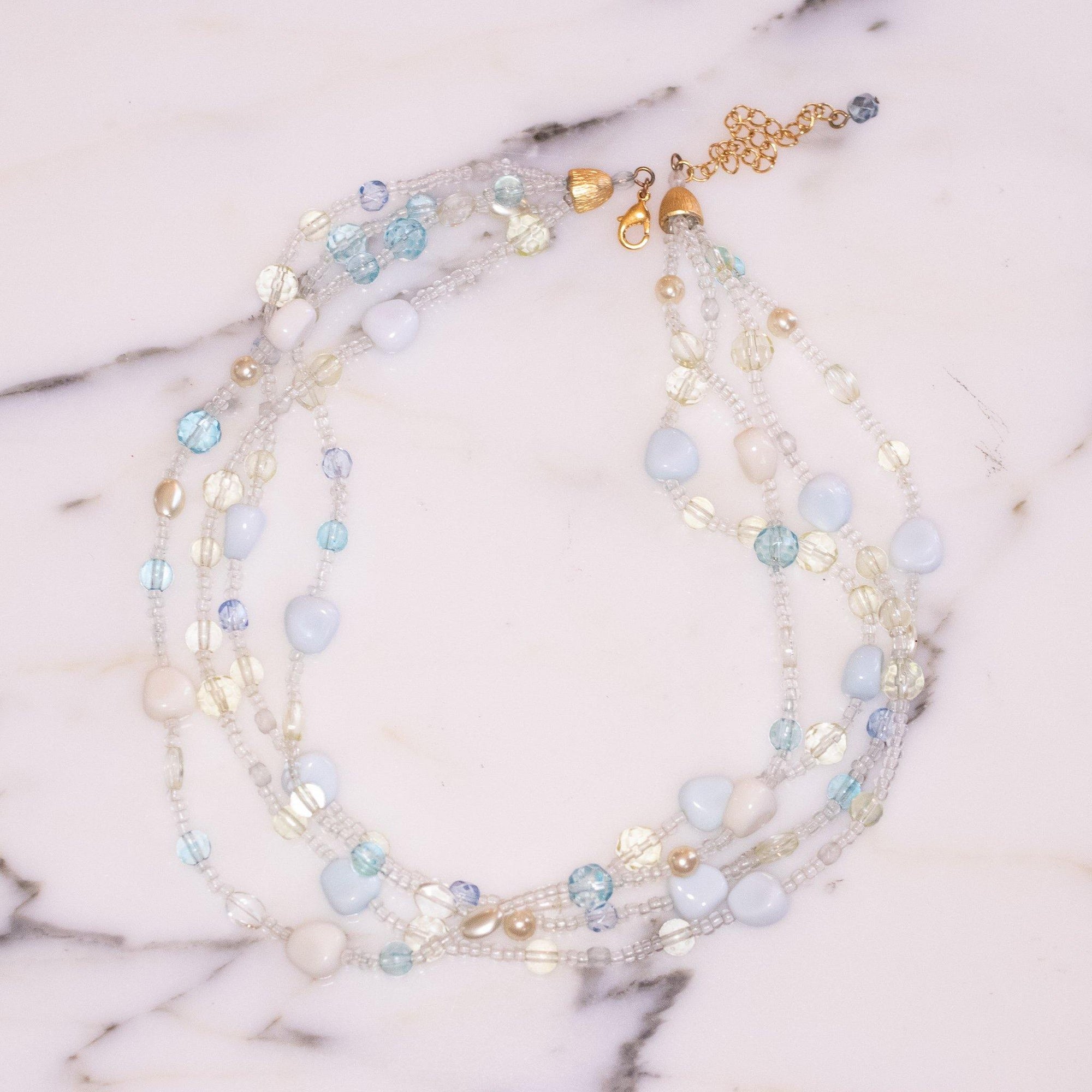 Vintage Four Strand Light Blue Bead Necklace by Avon - Vintage Meet Modern Vintage Jewelry - Chicago, Illinois - #oldhollywoodglamour #vintagemeetmodern #designervintage #jewelrybox #antiquejewelry #vintagejewelry