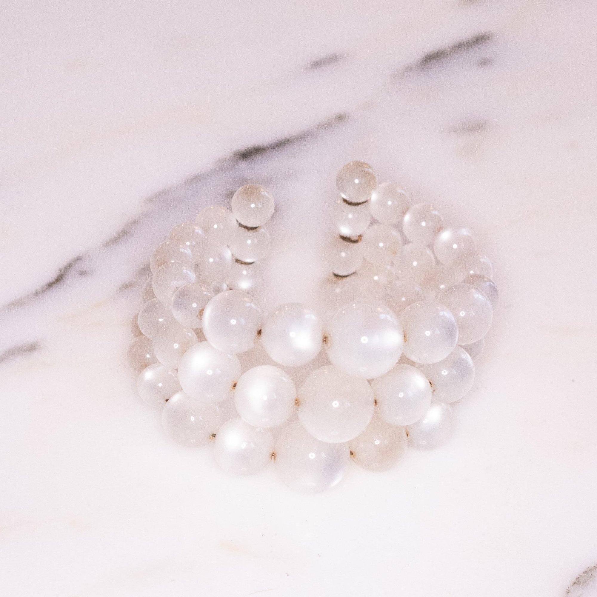 Vintage Lucite White Moonglow Triple Strand Expansion Bracelet by Unsigned Beauty - Vintage Meet Modern Vintage Jewelry - Chicago, Illinois - #oldhollywoodglamour #vintagemeetmodern #designervintage #jewelrybox #antiquejewelry #vintagejewelry