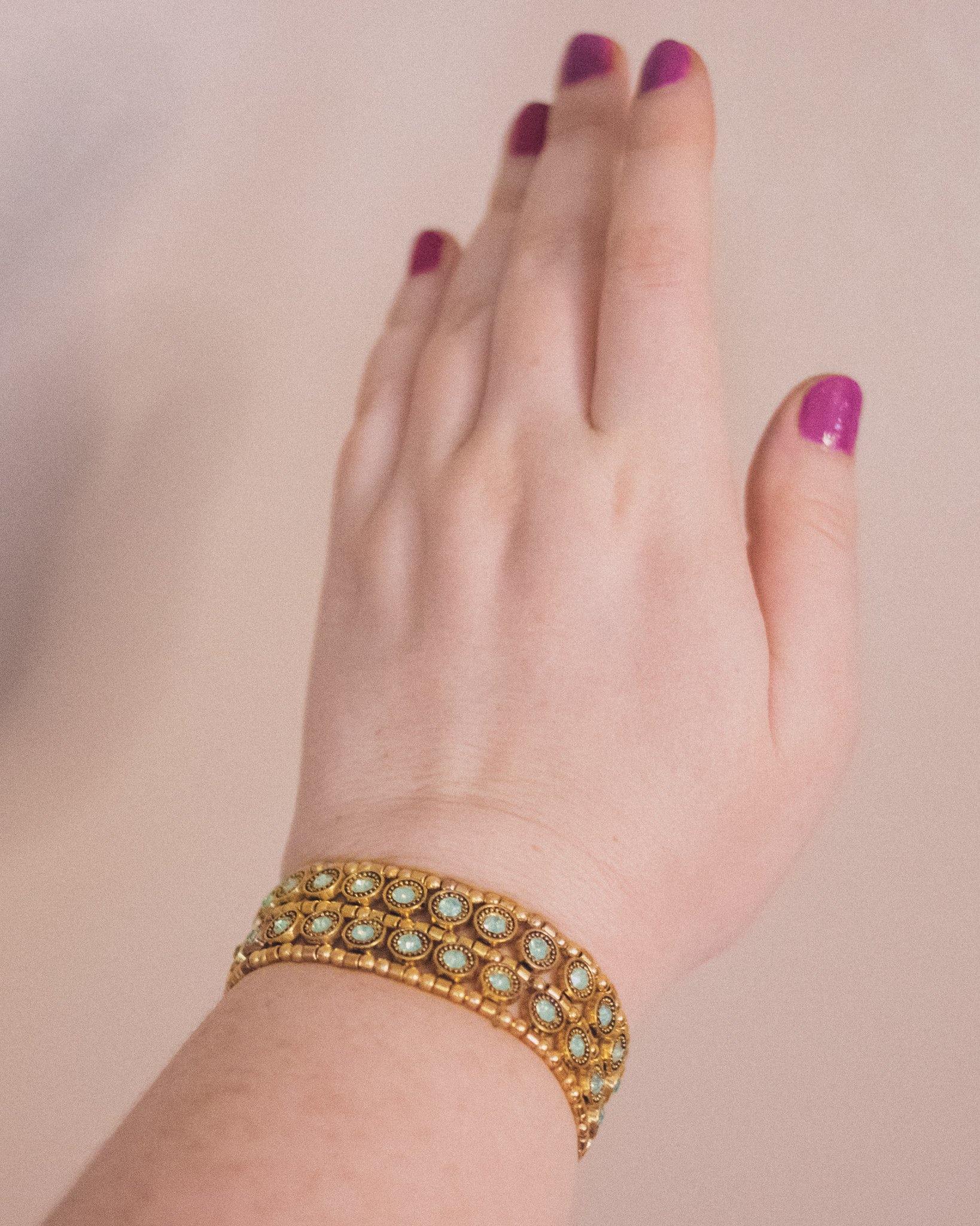 Vintage Light Green Crystal Stretch Bracelet set in Gold Tone by Unsigned Beauty - Vintage Meet Modern Vintage Jewelry - Chicago, Illinois - #oldhollywoodglamour #vintagemeetmodern #designervintage #jewelrybox #antiquejewelry #vintagejewelry