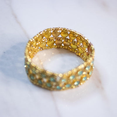 Vintage Light Green Crystal Stretch Bracelet set in Gold Tone by Unsigned Beauty - Vintage Meet Modern Vintage Jewelry - Chicago, Illinois - #oldhollywoodglamour #vintagemeetmodern #designervintage #jewelrybox #antiquejewelry #vintagejewelry
