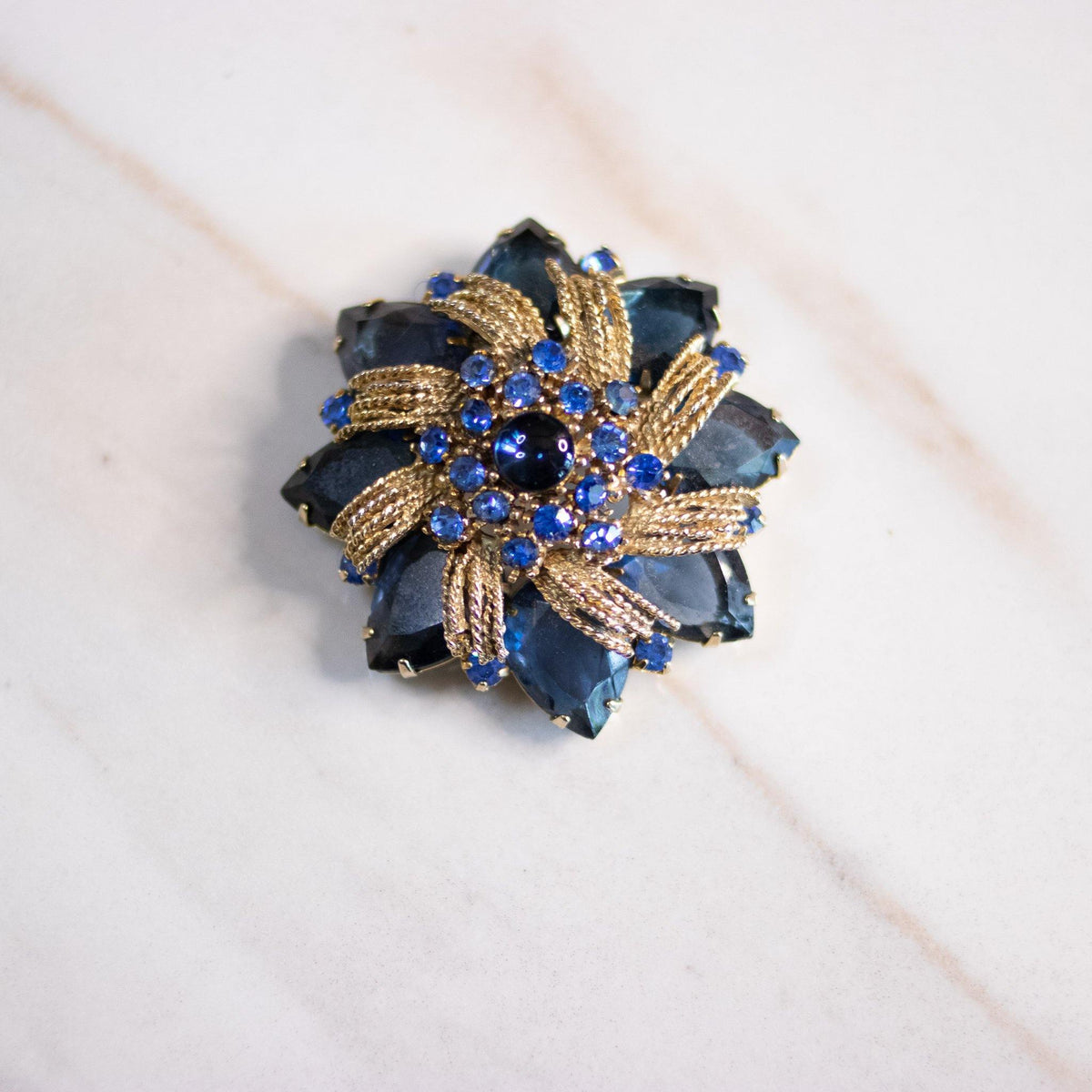 Vintage Blue Rhinestone Medallion Brooch with Gold Accents