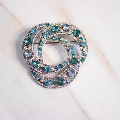 Vintage Silver Knot Brooch with Green, Aqua, and Aurora Borealis Brooch by Unsigned Beauty - Vintage Meet Modern Vintage Jewelry - Chicago, Illinois - #oldhollywoodglamour #vintagemeetmodern #designervintage #jewelrybox #antiquejewelry #vintagejewelry
