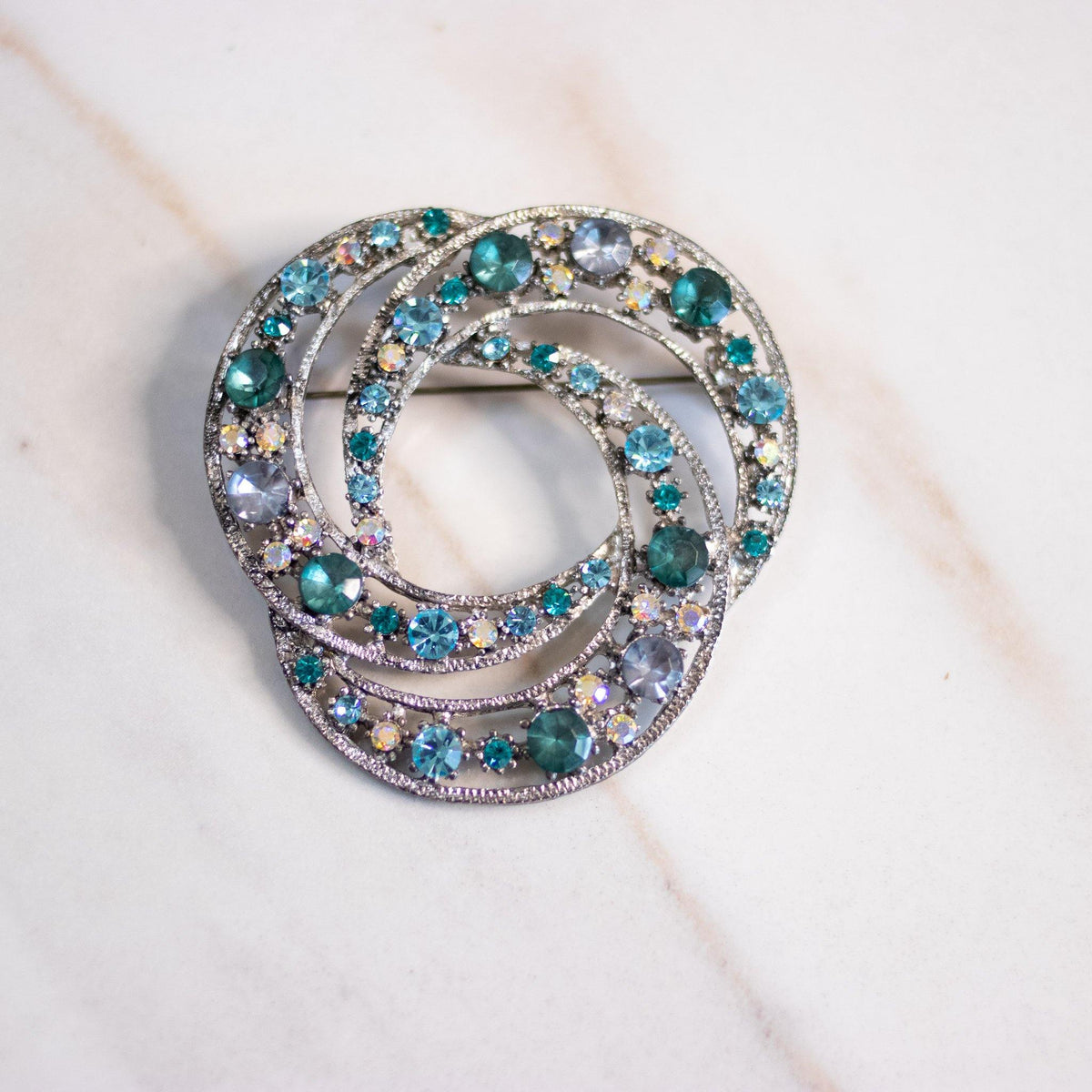 Vintage Silver Knot Brooch with Green, Aqua, and Aurora Borealis Brooch