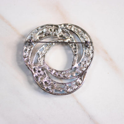 Vintage Silver Knot Brooch with Green, Aqua, and Aurora Borealis Brooch by Unsigned Beauty - Vintage Meet Modern Vintage Jewelry - Chicago, Illinois - #oldhollywoodglamour #vintagemeetmodern #designervintage #jewelrybox #antiquejewelry #vintagejewelry