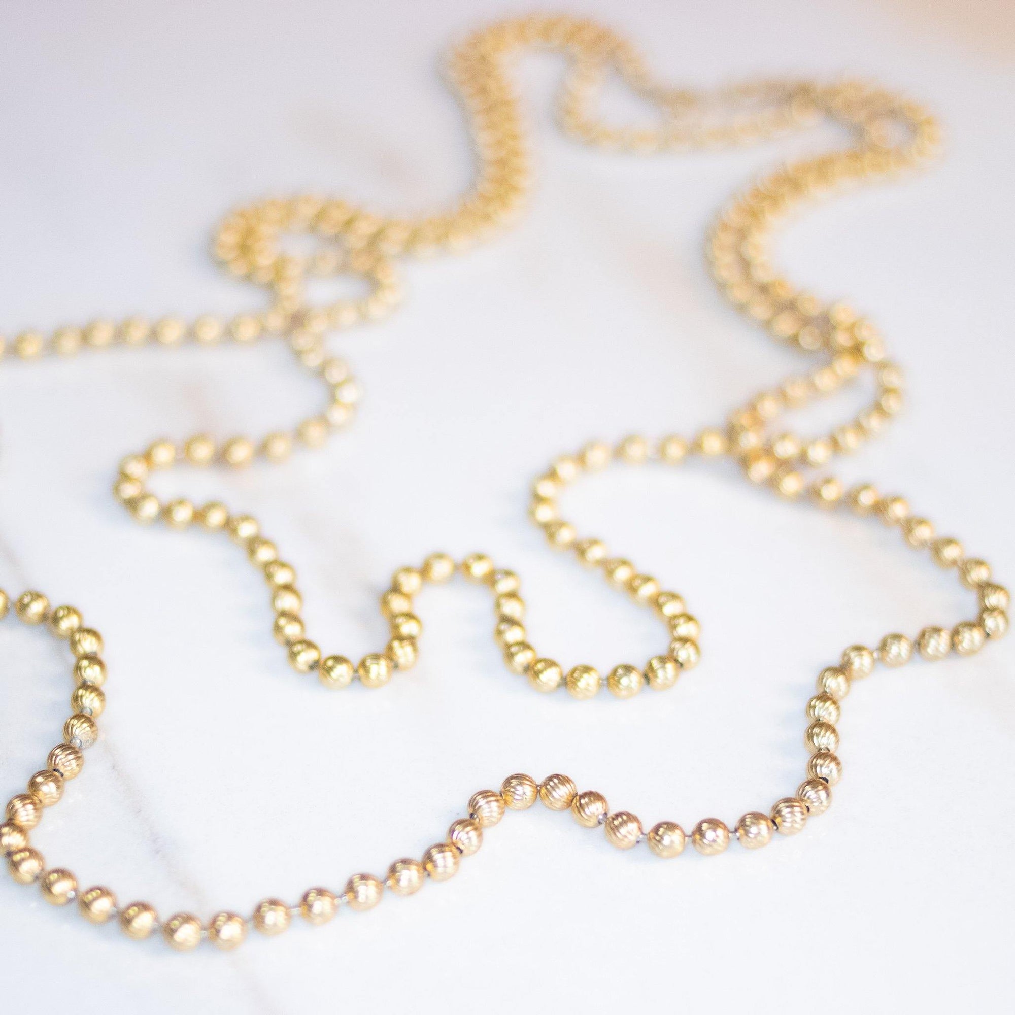 Vintage Opera Length Gold Bead Necklace by Unsigned Beauty - Vintage Meet Modern Vintage Jewelry - Chicago, Illinois - #oldhollywoodglamour #vintagemeetmodern #designervintage #jewelrybox #antiquejewelry #vintagejewelry