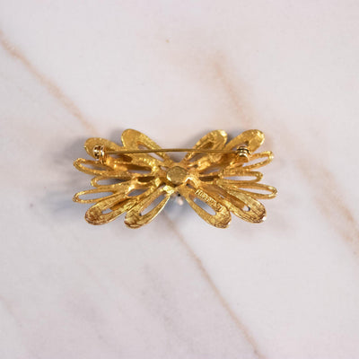 Vintage Florenza Mid Century Modern Bow Brooch with Light Blue Enamel and White Beads by Florenza - Vintage Meet Modern Vintage Jewelry - Chicago, Illinois - #oldhollywoodglamour #vintagemeetmodern #designervintage #jewelrybox #antiquejewelry #vintagejewelry