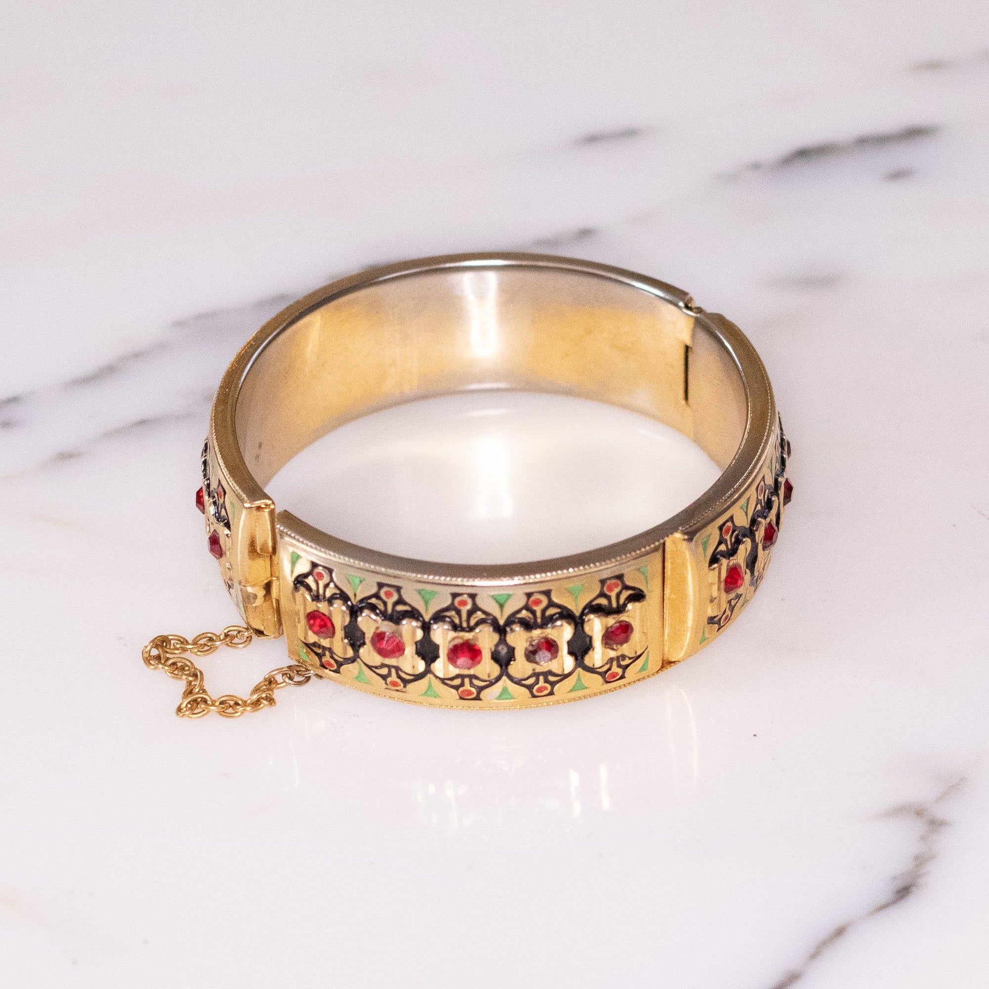 Vintage Gold Hinged Bangle Bracelet with Black and Green Enamel and Red Rhinestones by Czech - Vintage Meet Modern Vintage Jewelry - Chicago, Illinois - #oldhollywoodglamour #vintagemeetmodern #designervintage #jewelrybox #antiquejewelry #vintagejewelry