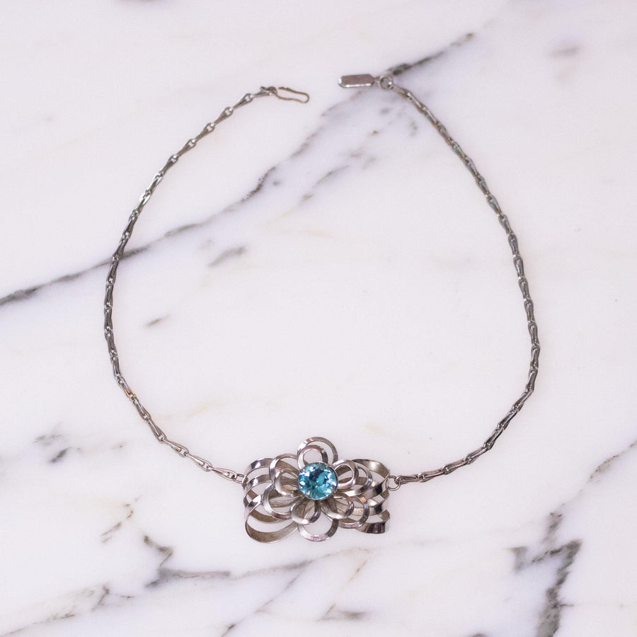 Vintage Mid Century Modern Silver Flower Necklace with Blue Rhinestone by Unsigned Beauty - Vintage Meet Modern Vintage Jewelry - Chicago, Illinois - #oldhollywoodglamour #vintagemeetmodern #designervintage #jewelrybox #antiquejewelry #vintagejewelry
