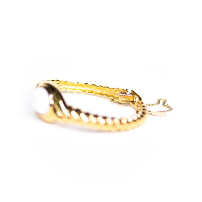 Vintage Monet Gold Cable Bracelet with Milk Glass Cabochon by Monet - Vintage Meet Modern Vintage Jewelry - Chicago, Illinois - #oldhollywoodglamour #vintagemeetmodern #designervintage #jewelrybox #antiquejewelry #vintagejewelry