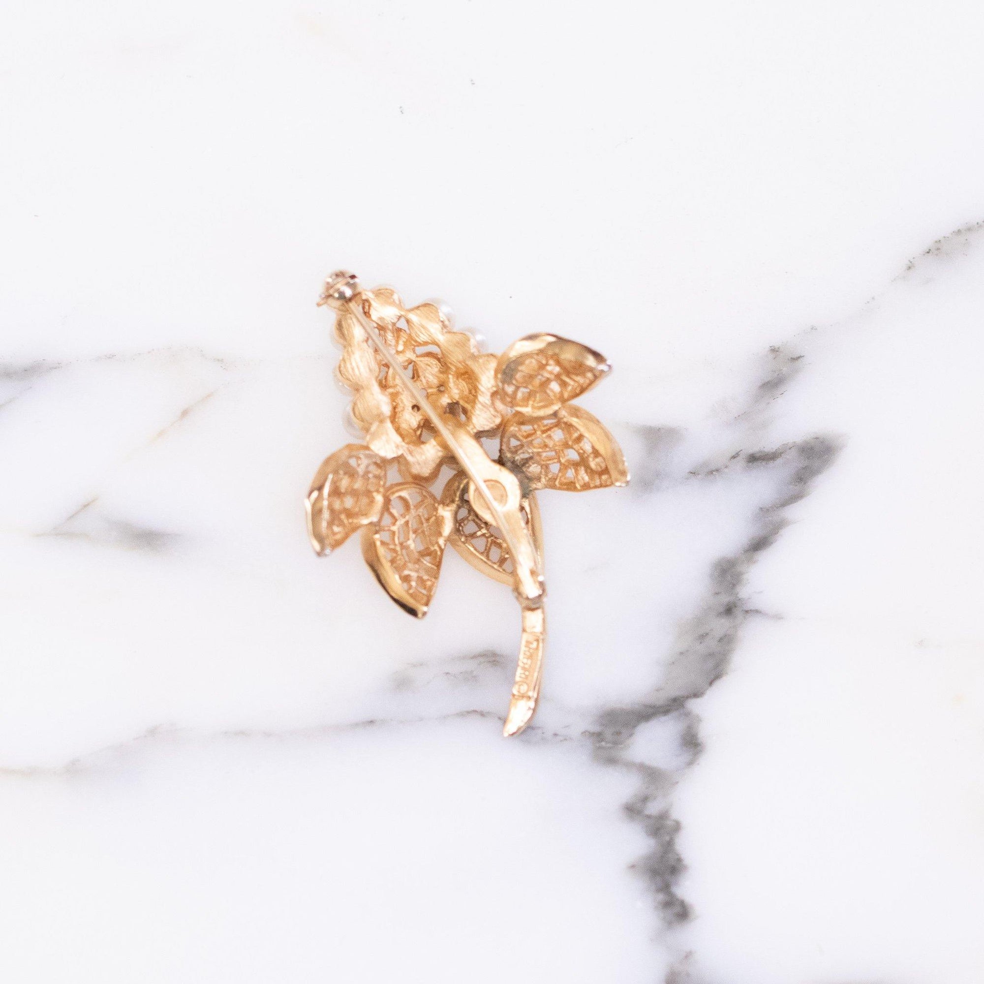 Vintage Crown Trifari Flower Brooch with Faux Pearls by Vintage Meet Modern - Vintage Meet Modern Vintage Jewelry - Chicago, Illinois - #oldhollywoodglamour #vintagemeetmodern #designervintage #jewelrybox #antiquejewelry #vintagejewelry