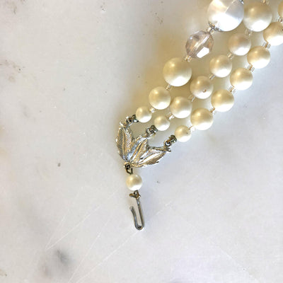 Vintage Pearl White Lucite Triple Strand Necklace by Vintage Meet Modern - Vintage Meet Modern Vintage Jewelry - Chicago, Illinois - #oldhollywoodglamour #vintagemeetmodern #designervintage #jewelrybox #antiquejewelry #vintagejewelry
