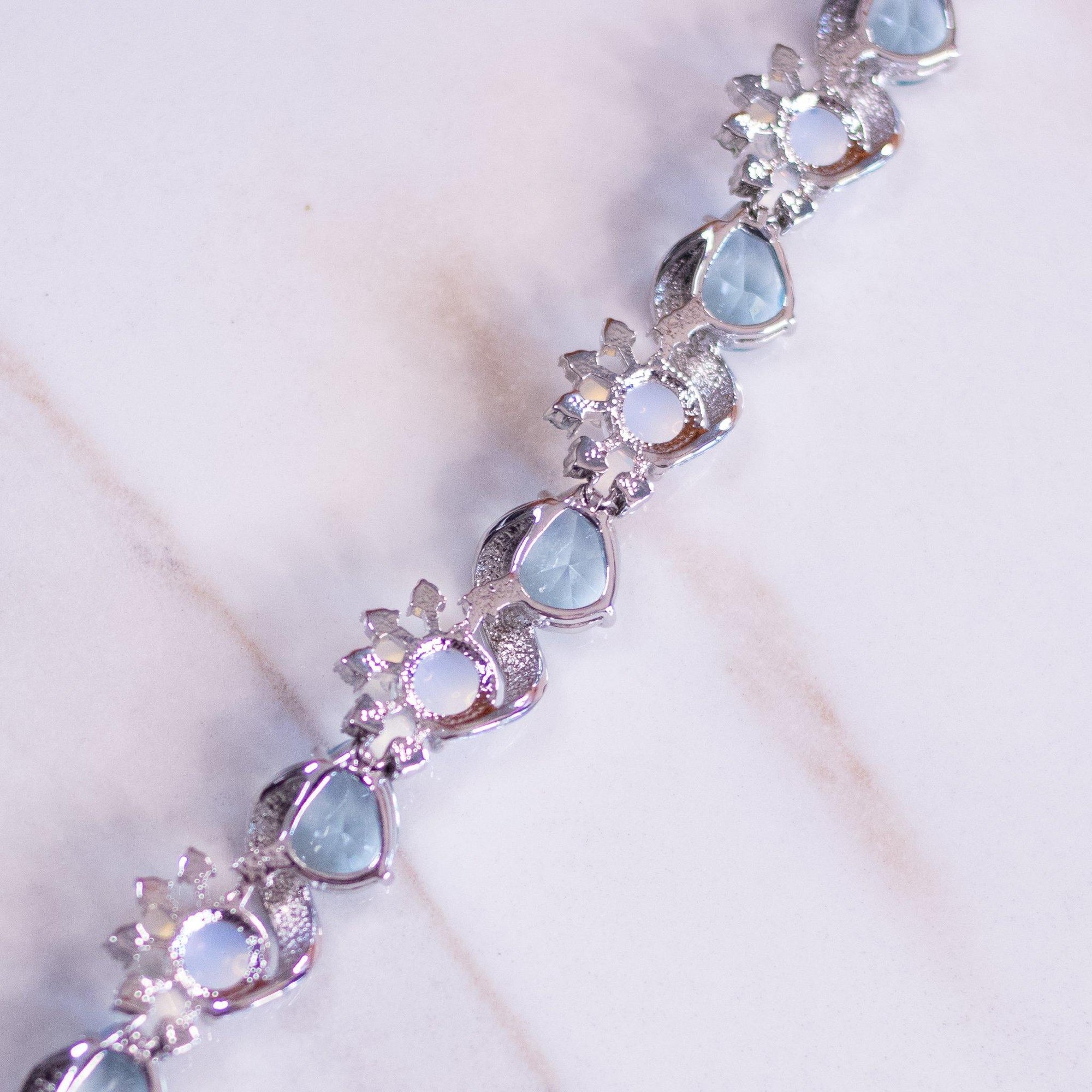 Vintage Camrose and Kross JBK Moonstone Glass and Blue Crystal Bracelet by Camrose and Kross - Vintage Meet Modern Vintage Jewelry - Chicago, Illinois - #oldhollywoodglamour #vintagemeetmodern #designervintage #jewelrybox #antiquejewelry #vintagejewelry