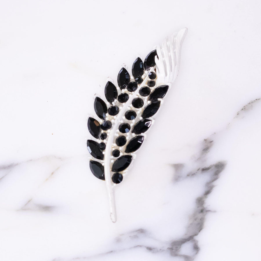 Vintage White Enamel Brooch with Jet Black Crystal Leaves by Vintage Meet Modern - Vintage Meet Modern Vintage Jewelry - Chicago, Illinois - #oldhollywoodglamour #vintagemeetmodern #designervintage #jewelrybox #antiquejewelry #vintagejewelry