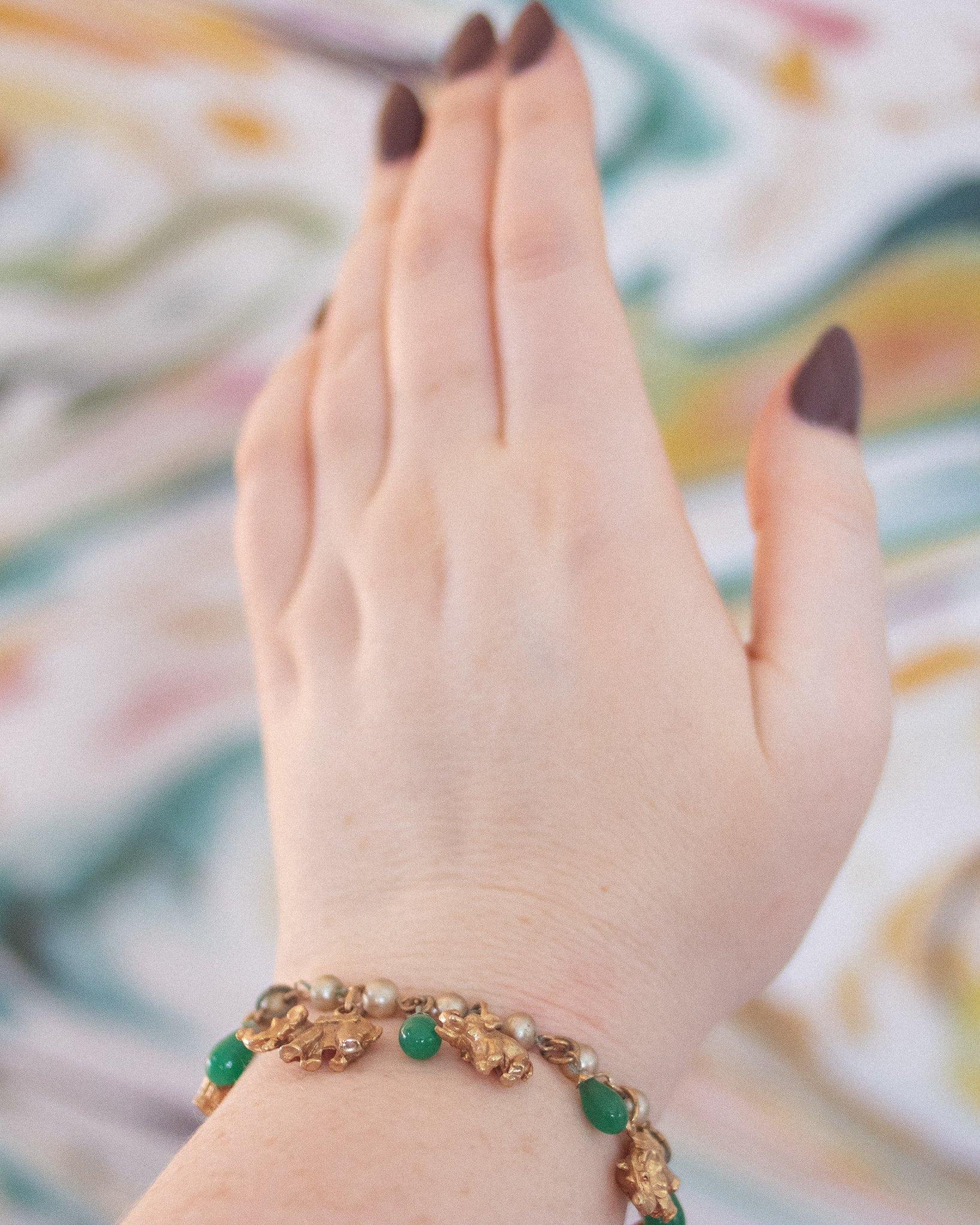 Vintage Faux Pearl with Gold Walking Elephant and Jade Glass Bead Charm Bracelet by Vintage Meet Modern - Vintage Meet Modern Vintage Jewelry - Chicago, Illinois - #oldhollywoodglamour #vintagemeetmodern #designervintage #jewelrybox #antiquejewelry #vintagejewelry