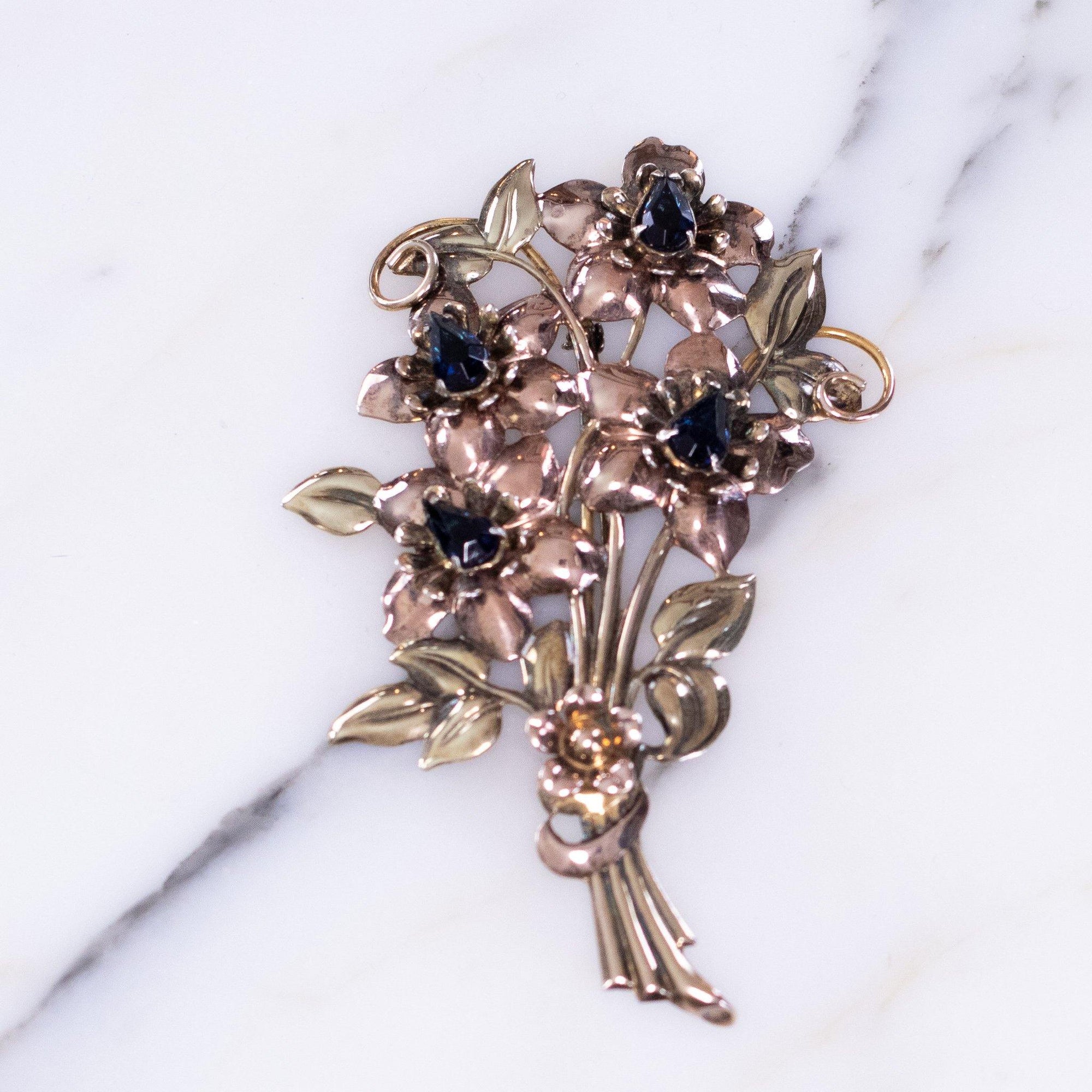 Vintage 1940s Floral Bouquet Brooch Sterling Silver and Rose Gold Filled with Sapphire Blue Crystals by Vintage Meet Modern - Vintage Meet Modern Vintage Jewelry - Chicago, Illinois - #oldhollywoodglamour #vintagemeetmodern #designervintage #jewelrybox #antiquejewelry #vintagejewelry