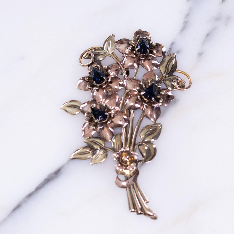 Vintage 1940s Floral Bouquet Brooch Sterling Silver and Rose Gold Filled with Sapphire Blue Crystals by Vintage Meet Modern - Vintage Meet Modern Vintage Jewelry - Chicago, Illinois - #oldhollywoodglamour #vintagemeetmodern #designervintage #jewelrybox #antiquejewelry #vintagejewelry