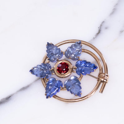 Vintage 1940s Blue Leaf and Red Crystal Medallion Brooch by Vintage Meet Modern  - Vintage Meet Modern Vintage Jewelry - Chicago, Illinois - #oldhollywoodglamour #vintagemeetmodern #designervintage #jewelrybox #antiquejewelry #vintagejewelry