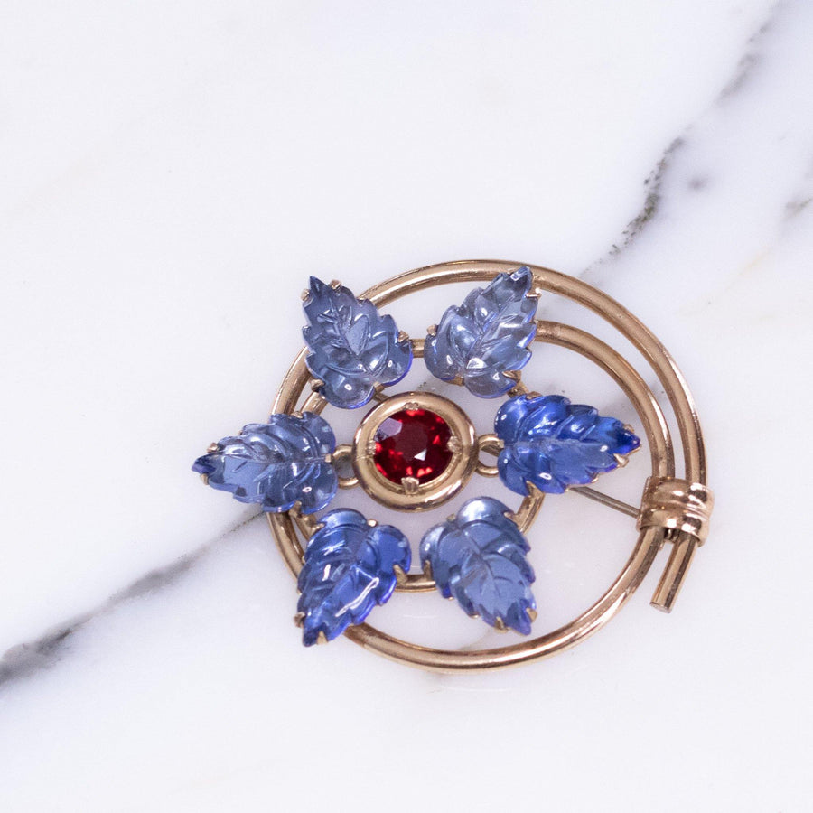 Vintage 1940s Blue Leaf and Red Crystal Medallion Brooch by Vintage Meet Modern - Vintage Meet Modern Vintage Jewelry - Chicago, Illinois - #oldhollywoodglamour #vintagemeetmodern #designervintage #jewelrybox #antiquejewelry #vintagejewelry