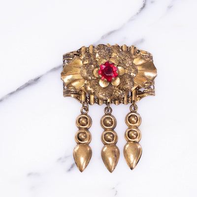 Vintage 1940s Gilt Brooch with Dangles and Red Rhinestone by Vintage Meet Modern  - Vintage Meet Modern Vintage Jewelry - Chicago, Illinois - #oldhollywoodglamour #vintagemeetmodern #designervintage #jewelrybox #antiquejewelry #vintagejewelry